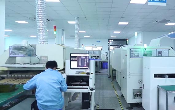 Workers Are Operating The LED Display Production Machine